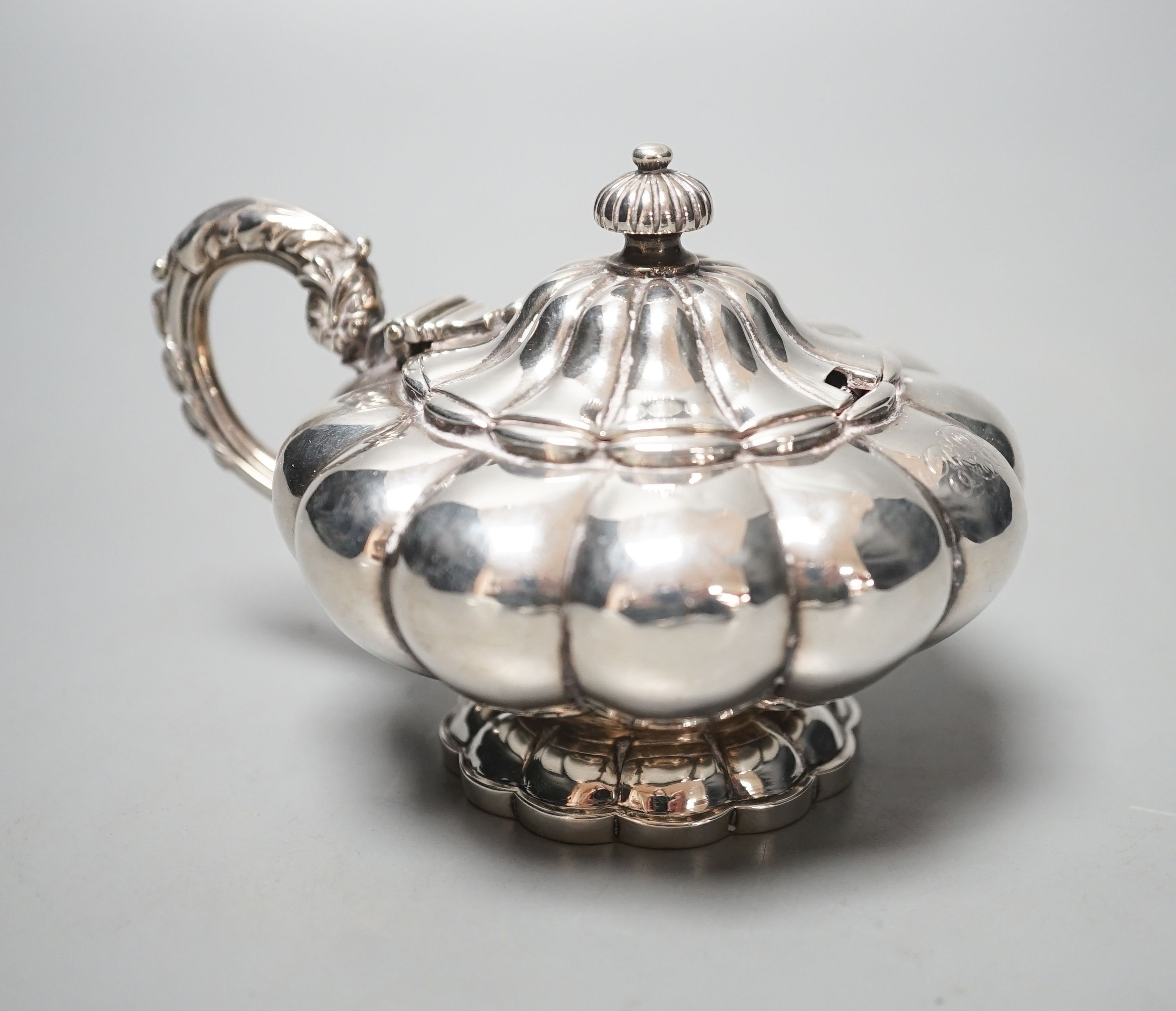 A George IV silver melon shape mustard pot, maker's, John & Thomas Cutmore?, London, 1828, height 74mm.